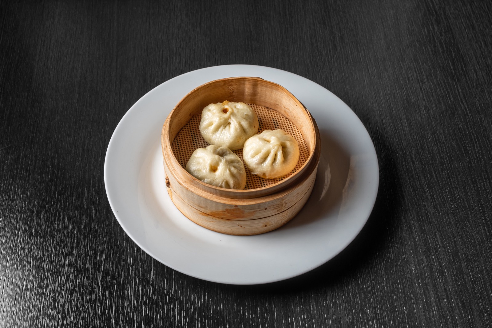 Dumplings mit Ibérico und schwarzen Bohnen